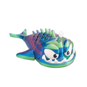 Rybeł – tęczowy brelok ryba z druku 3D leżący na boku. Morski potwór z szeroko otwartą paszczą pełną białych zębów, dużymi oczami i rzędem kolców na grzbiecie. Gradient kolorów: zielony, niebieski, fioletowy, różowy. Widoczne metalowe kółko do zawieszenia.