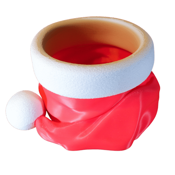 Czapa Mikołaja pojemnik na cukierki z druku 3D, czerwona miseczka z białym otokiem i pomponem, widoczne warstwy