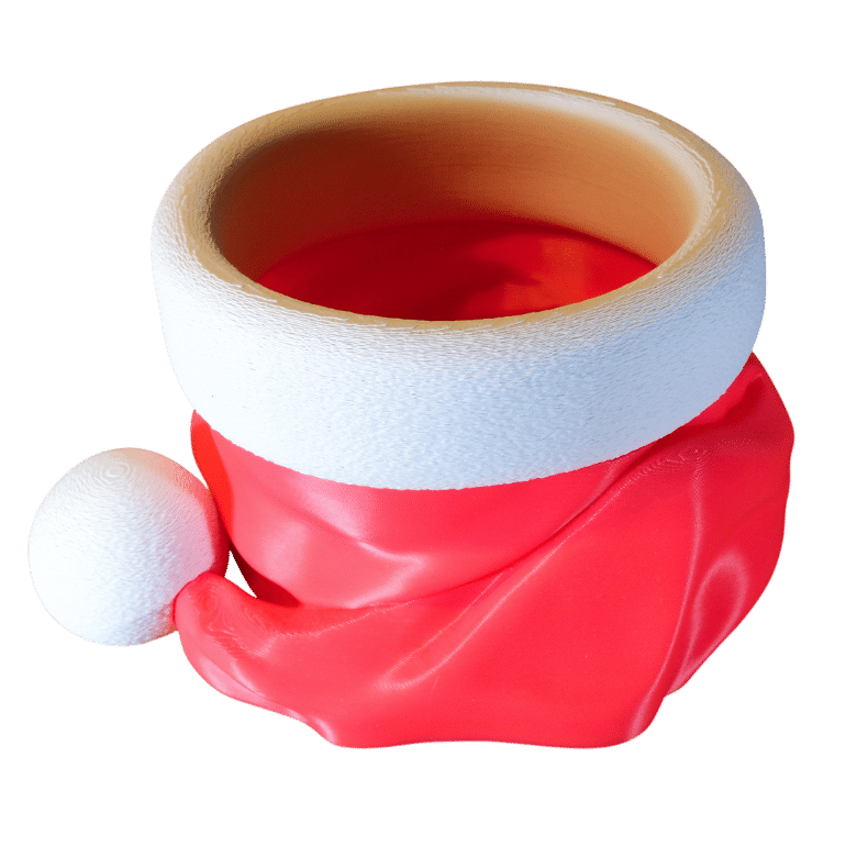 Czapa Mikołaja pojemnik na cukierki z druku 3D, czerwona miseczka z białym otokiem i pomponem, widoczne warstwy