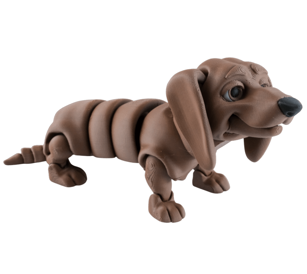 Dżamnig figurka jamnika z druku 3D brązowa, ruchomy segmentowany tułów, długie uszy, czarny nos